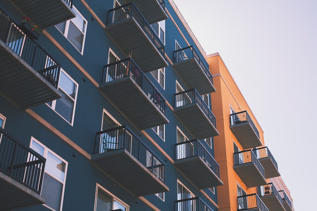 Low-angle view of a modern building in the Spanish real estate market.