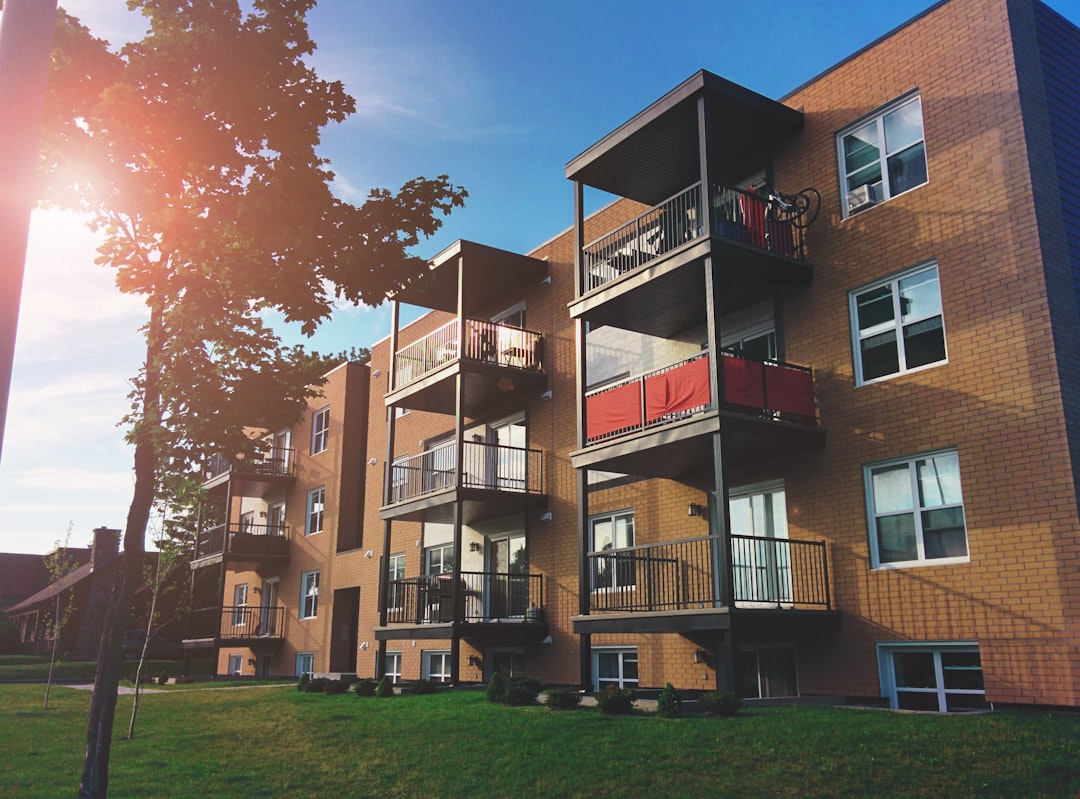 Brown brick four-story building in an urban setting.